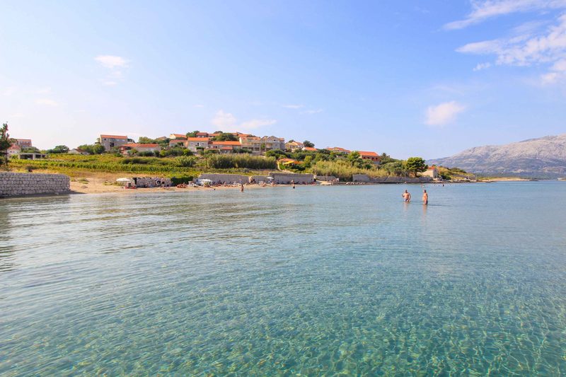 Bilin Žal sandy beach Lumbarda — shallow water with views of Pelješac