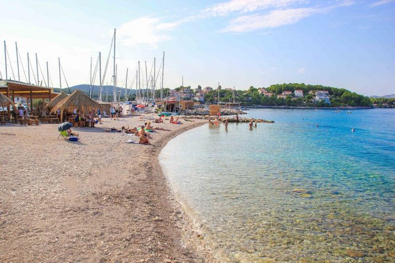 Prvi Žal beach in front of Lumbarda Resort — marina and beach bar