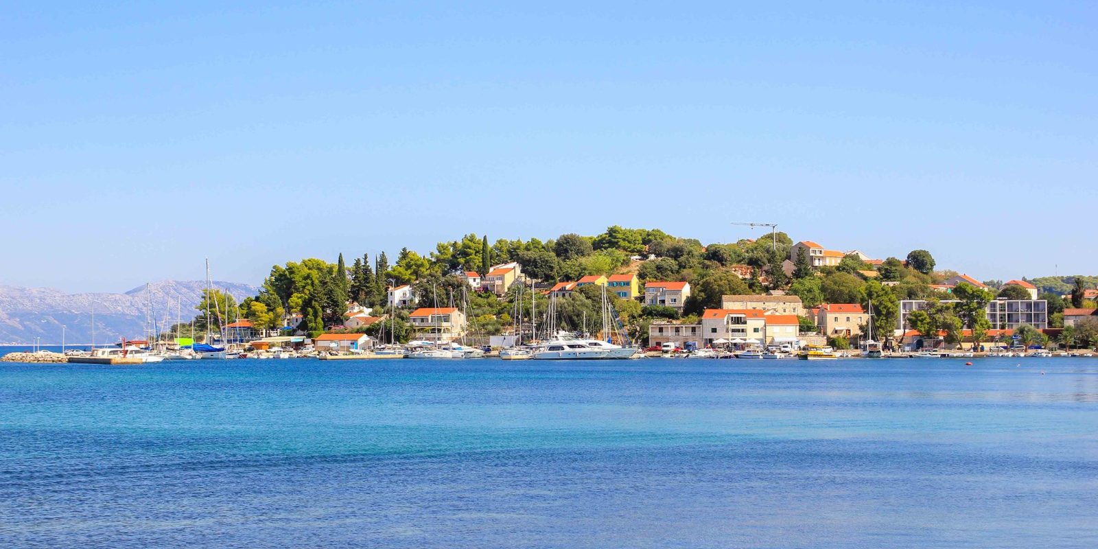 Lumbarda village panorama — view from the sea with marina and vineyards